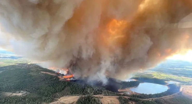 In a photo provided by Alberta Wildfire shows, Smoke rising from a wildfire near Lodgepole, Alberta, on Thursday, May 4, 2023. Over 100 wildfires were burning across Alberta on Saturday, May 6. Conditions conducive to fires were also expected in the U.S. Southwest over the weekend. (Alberta Wildfire via The New York Times) -- NO SALES; EDITORIAL USE ONLY --